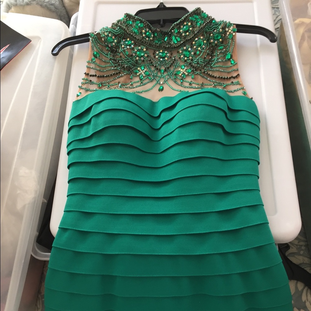 Sherri Hill emerald green cocktail dress.